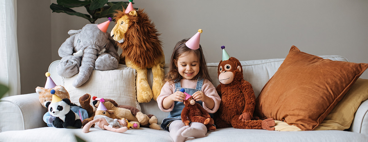 The-baby-is-playing-with-a-plush-toy-at-home.jpg